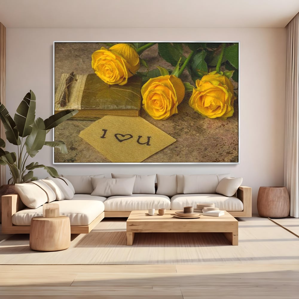 Tablou canvas cu tablou canvas cu trandafiri galbeni si jurnal, in rama de aluminiu argintiu, pe perete intr-un living